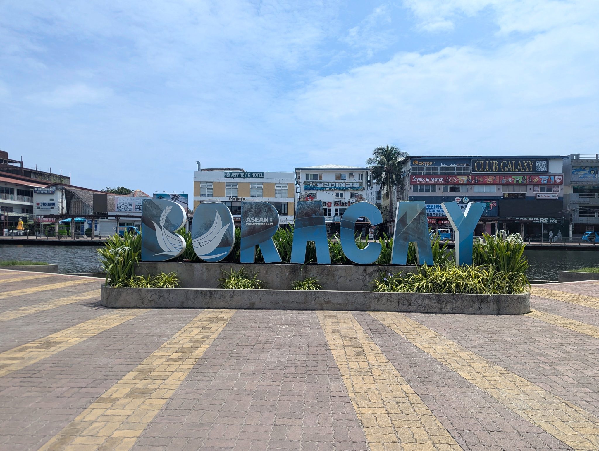 Large BORACAY letter sign on a paved plaza